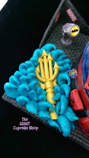 Aquaman's golden trident cake topper