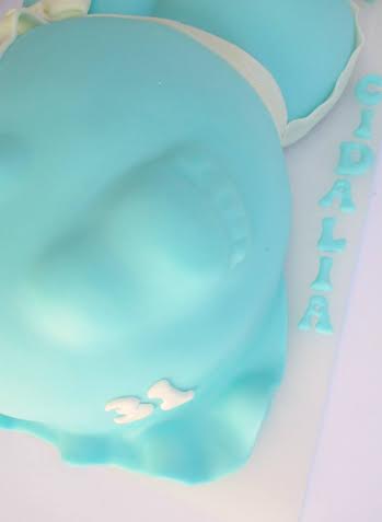 foot on baby bump baby shower cake